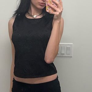 Cute detailed black top with a zipper at the back
Brand: RW&Co. Size is S